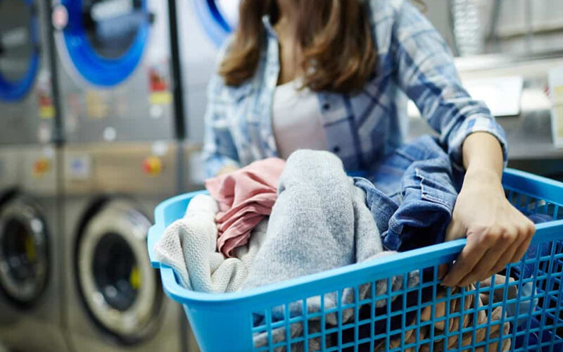 What is the difference between self-service and full-service laundromats?