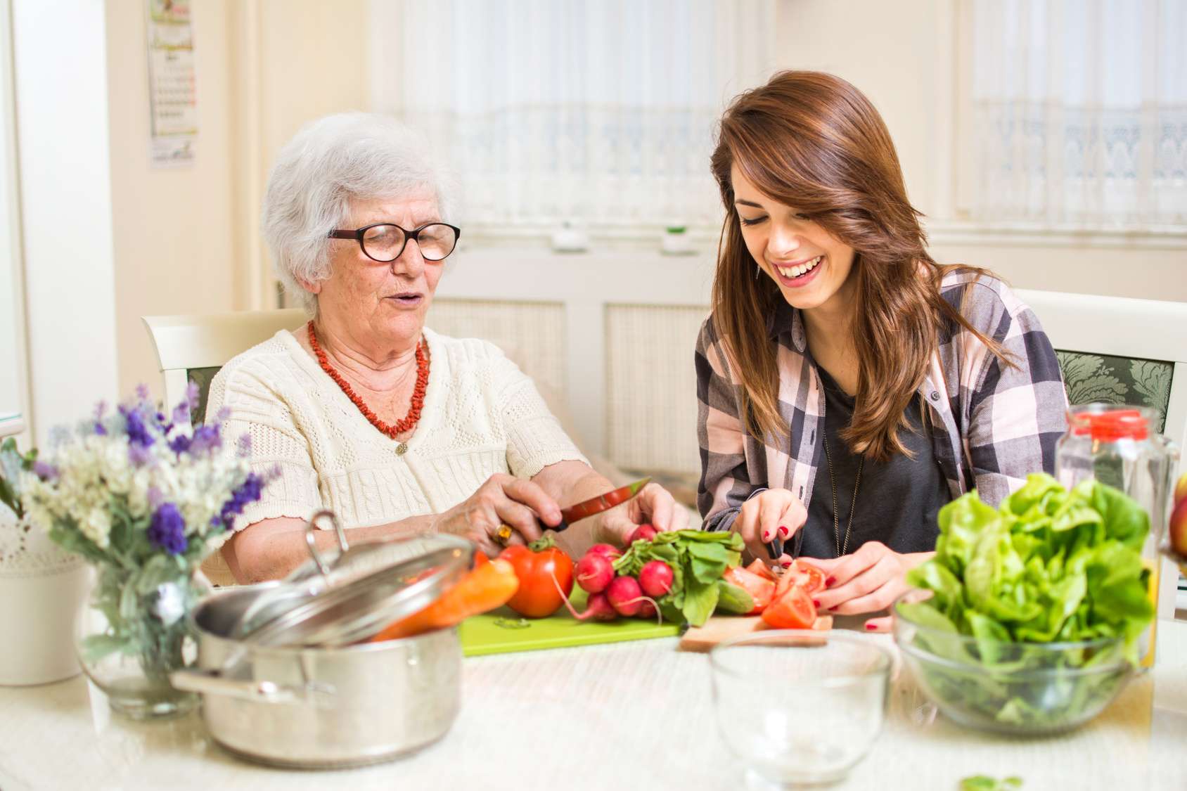 How can families help seniors with daily living tasks?